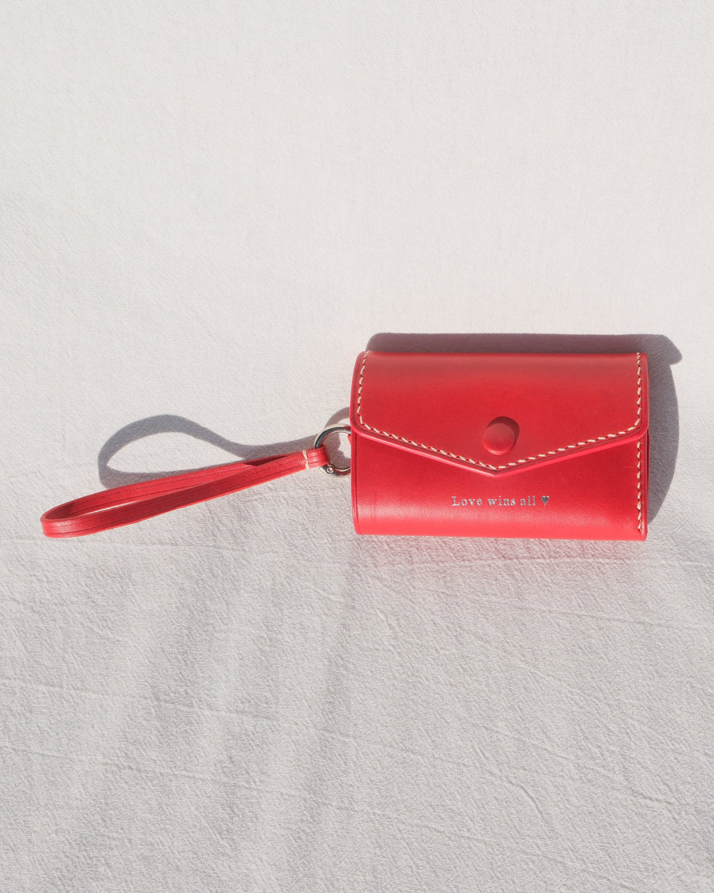 Red wallet with a strap 