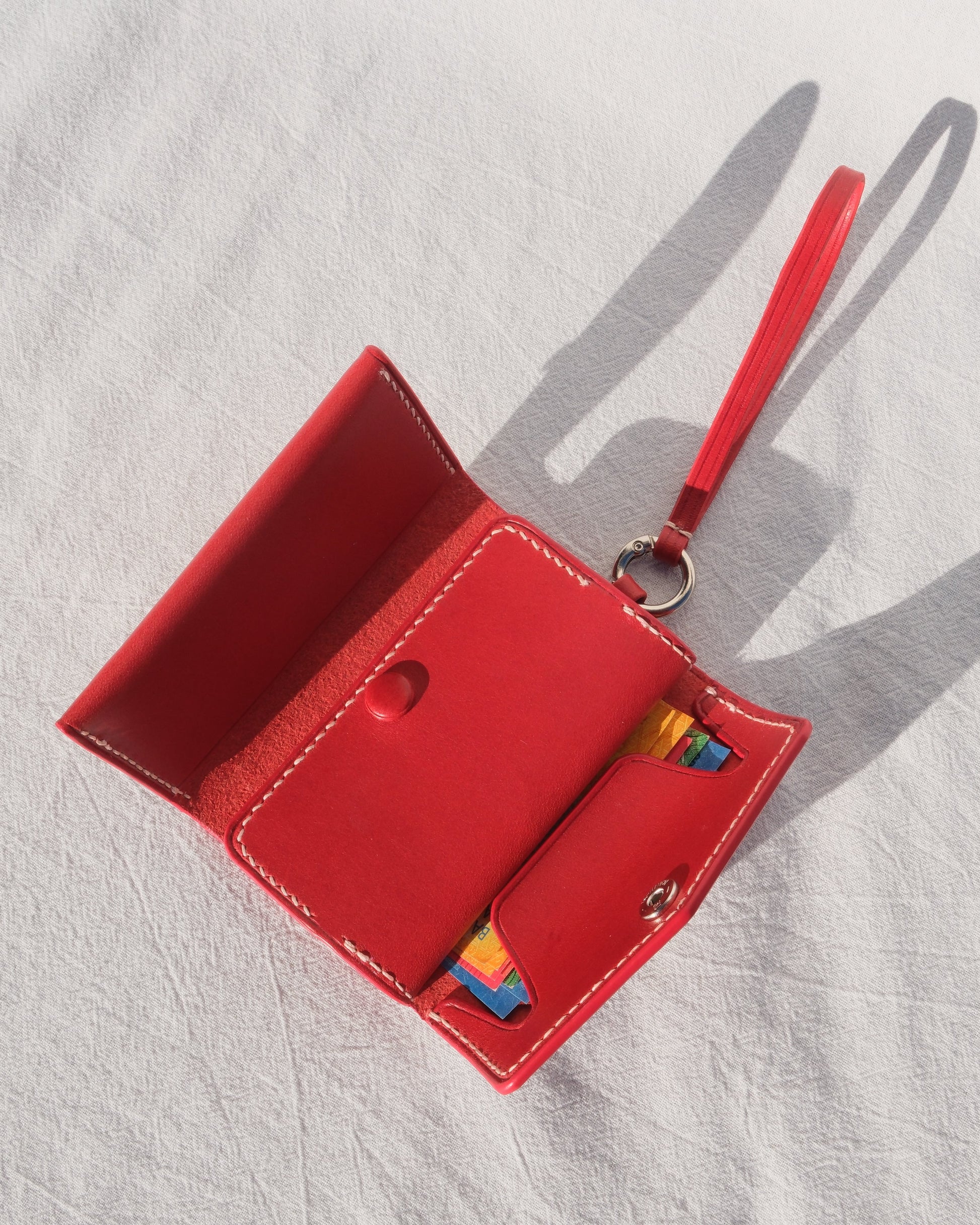 Red wallet with a strap