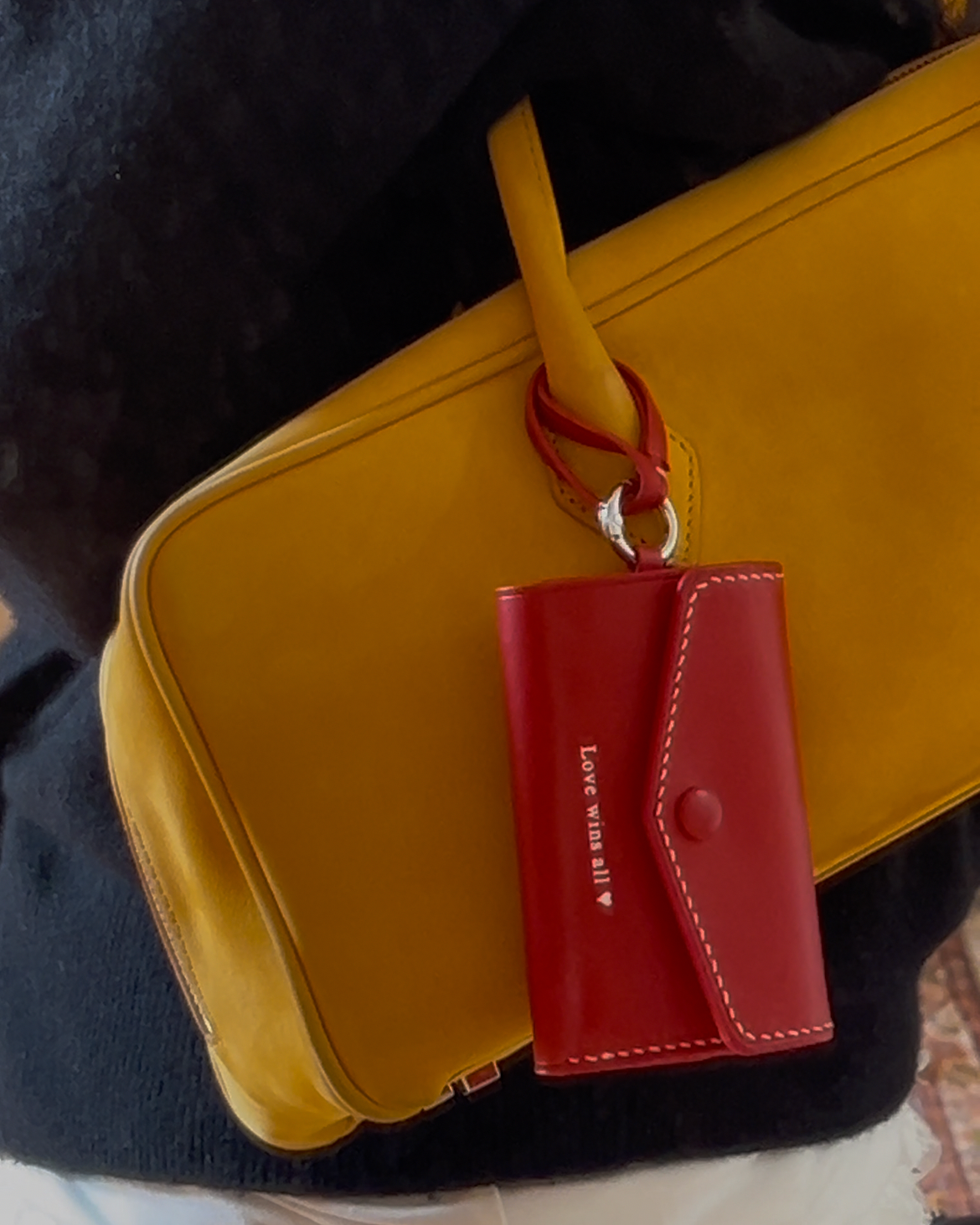 Yellow handbag with a red wallet